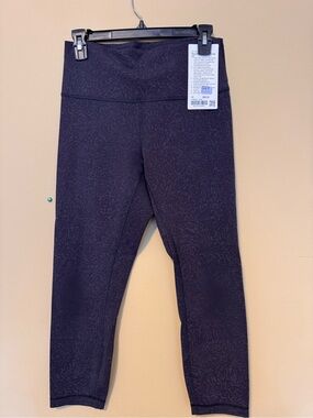 Lululemon Women’s Wunder Train HR Black patterned Crop 23” Size 10